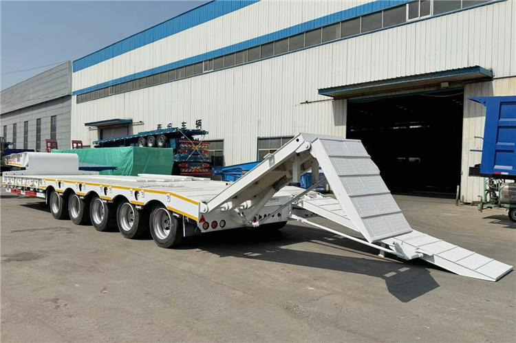 TITAN 5 Axle 100 Ton Low Bed Trailer for Sale In Tanzania - Полуприколка за низок утовар: слика 1 TITAN 5 Axle 100 Ton Low Bed Trailer for Sale In Tanzania - Полуприколка за низок утовар: слика 1