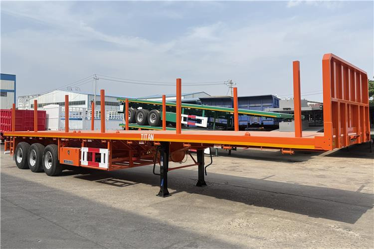 TITAN Container Flatbed Truck Trailer with Piles In Angola - Транспортер на контејнер/ Полуприколка со променливо тело: слика 1 TITAN Container Flatbed Truck Trailer with Piles In Angola - Транспортер на контејнер/ Полуприколка со променливо тело: слика 1