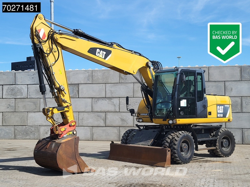 Caterpillar M315 D - Багер на тркала: слика 1 Caterpillar M315 D - Багер на тркала: слика 1