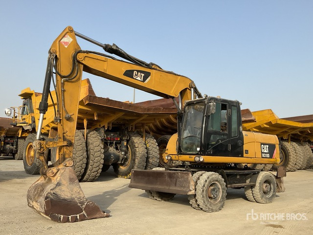 2012 Cat M318D - Багер на тркала: слика 2 2012 Cat M318D - Багер на тркала: слика 2