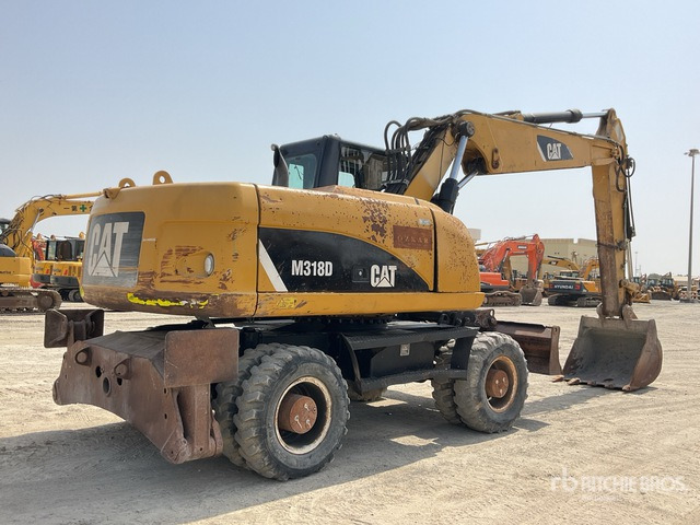 2012 Cat M318D - Багер на тркала: слика 3 2012 Cat M318D - Багер на тркала: слика 3