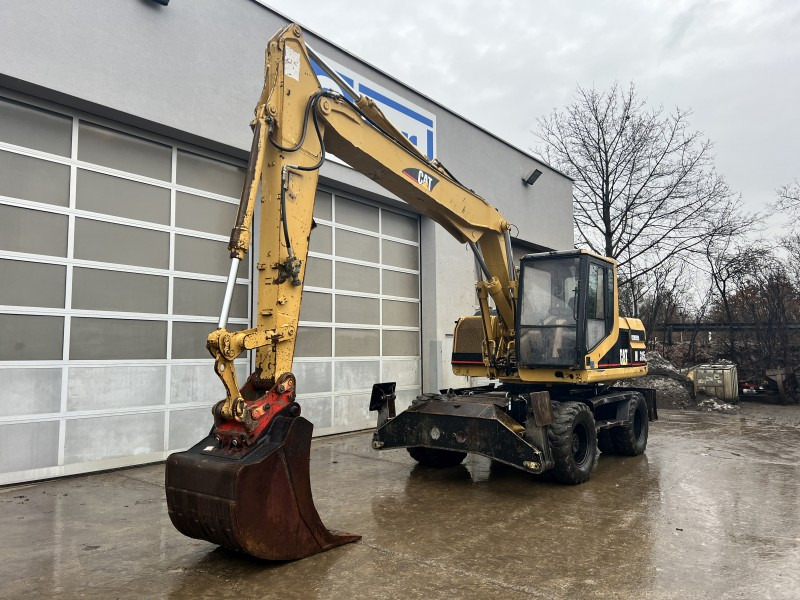 Caterpillar M 315 (111063) - Багер на тркала: слика 2 Caterpillar M 315 (111063) - Багер на тркала: слика 2
