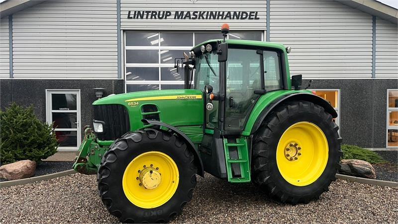 John Deere 6534 Premium med frontlift og frontPTO - Трактор: слика 1 John Deere 6534 Premium med frontlift og frontPTO - Трактор: слика 1