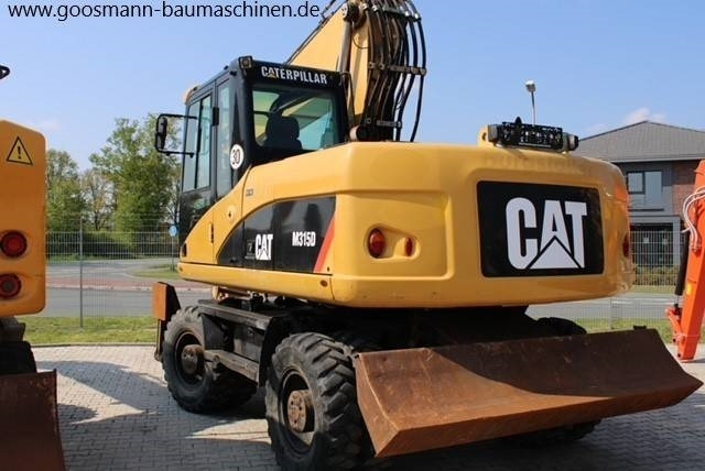 CAT M 315D - Багер на тркала: слика 2 CAT M 315D - Багер на тркала: слика 2
