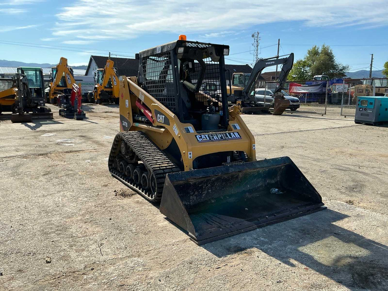 Caterpillar 247B - Компактен натоварувач: слика 1 Caterpillar 247B - Компактен натоварувач: слика 1