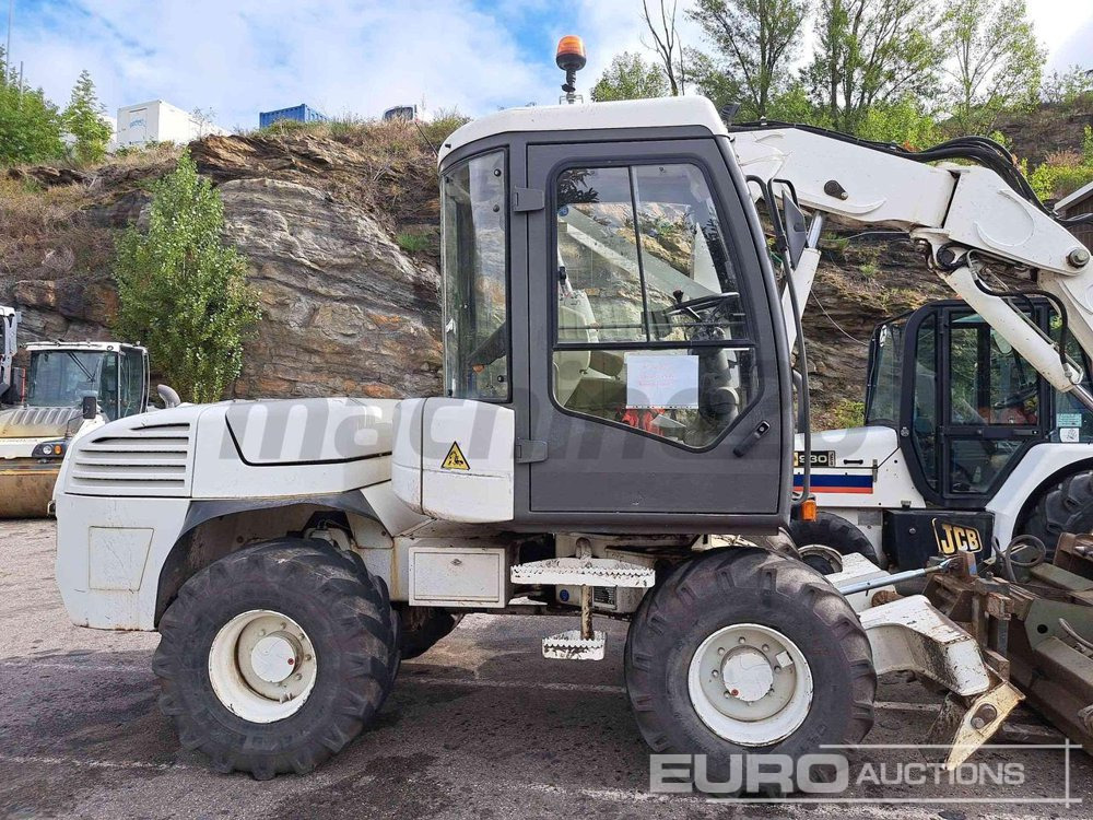 2014 Mecalac 12 MTX - Багер на тркала: слика 1 2014 Mecalac 12 MTX - Багер на тркала: слика 1