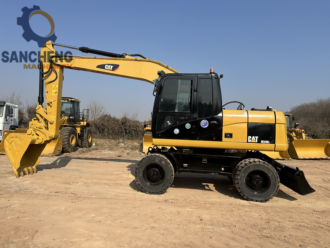 CATERPILLAR M320D2 - Багер на тркала: слика 2 CATERPILLAR M320D2 - Багер на тркала: слика 2