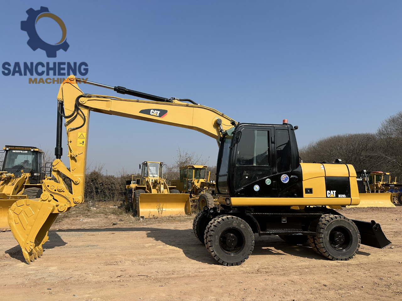CATERPILLAR M320D2 wheel excavator - Багер на тркала: слика 2 CATERPILLAR M320D2 wheel excavator - Багер на тркала: слика 2