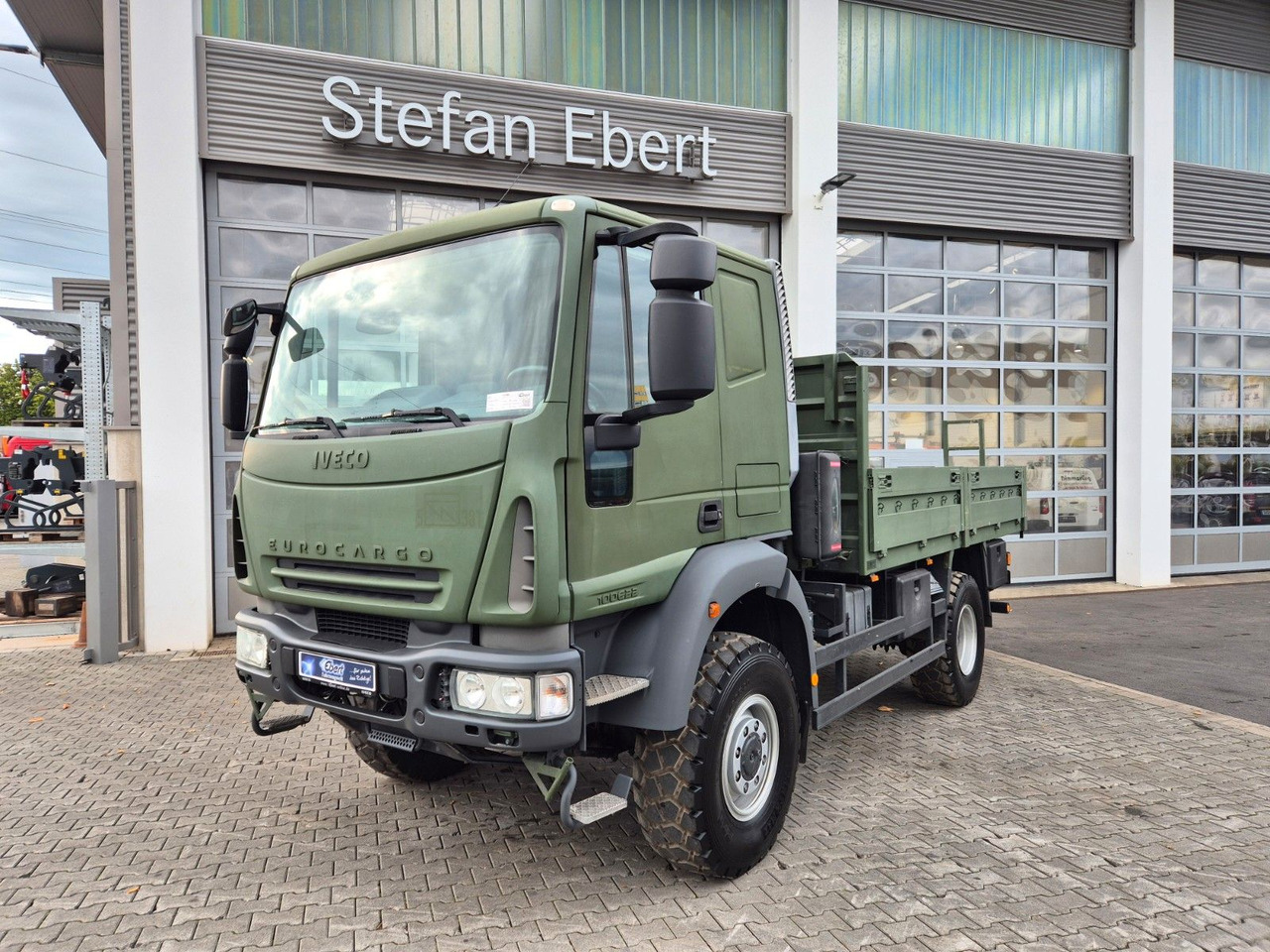 Iveco Eurocargo ML100E22WM-BW 4x4 Pritsche L-Haus Bett - Камион со платформа: слика 1 Iveco Eurocargo ML100E22WM-BW 4x4 Pritsche L-Haus Bett - Камион со платформа: слика 1