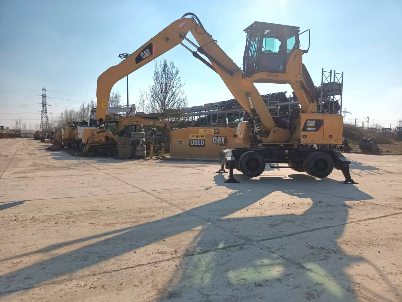 CAT MH3022 - Багер на тркала: слика 1 CAT MH3022 - Багер на тркала: слика 1