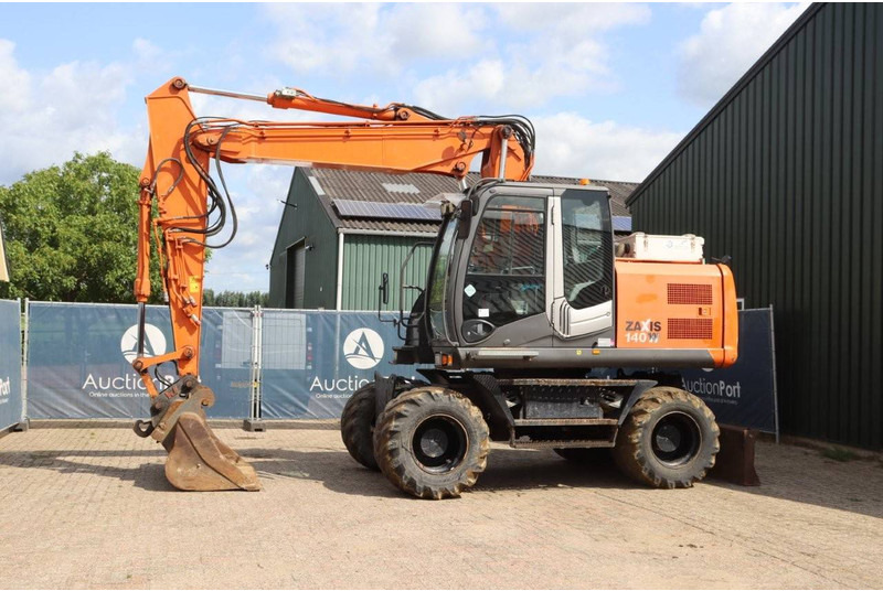 Hitachi ZX140W-3 - Багер на тркала: слика 1 Hitachi ZX140W-3 - Багер на тркала: слика 1