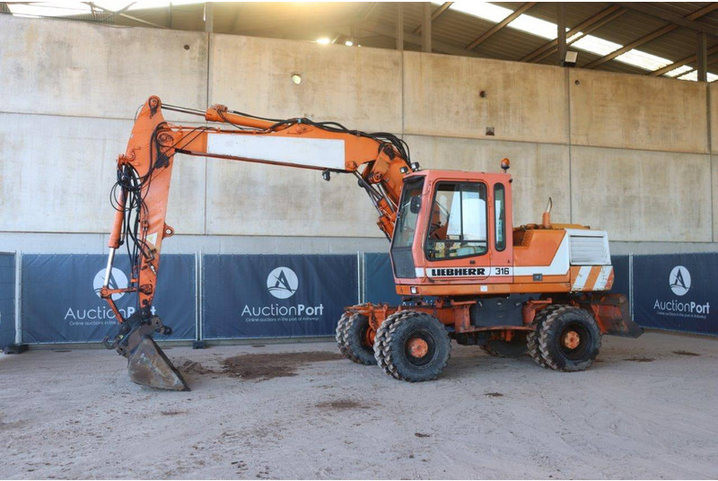 Liebherr A316 - Багер на тркала: слика 1 Liebherr A316 - Багер на тркала: слика 1